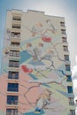 KYIV, UKRAINE - MAR 19, 2019: birds on the branches - part of large-scale legal graffiti on the wall of a multistory building