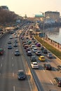 Automobile collapse at the highway along Dnipro River. Traffic jam with rows of cars on motorway in the week-end day in Kyiv