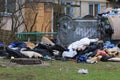 Environmental pollution. Garbage dump on the grass near a multi-storey building in a big city, polluting nature with rubbish.