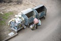 KYIV, UKRAINE MARCH 31, 2019: A homeless man looking for food in a garbage dumpster. Urban Poverty