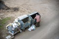 KYIV, UKRAINE MARCH 31, 2019: A homeless man looking for food in a garbage dumpster. Urban Poverty