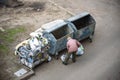 KYIV, UKRAINE MARCH 31, 2019: A homeless man looking for food in a garbage dumpster. Urban Poverty