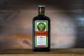 Label and trademark of Jagermeister liquor on glass bottle, close up. German digestif made with 56 herbs and spices Royalty Free Stock Photo