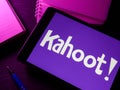 KYIV, UKRAINE - March 30, 2022. Tablet with kahoot logo and notebooks.