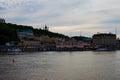 Amazing sunset landscape view of Poshtova Square with white River Port building and other historical buildings.