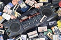 KYIV, UKRAINE - 4 MAY, 2023: Audio cassettes stacked and placed around obsolete record player