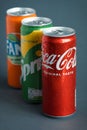KYIV, UKRAINE - May 09: Close up shot of classic Coca-Cola, Sprite and Fanta cans on the grey background. Popular products of The