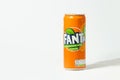 Close up shot of classic Fanta orange can on the white background. Popular product of The Coca-Cola