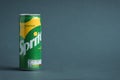 Close up shot of classic Sprite green can on the grey background. Popular product of The Coca-Cola company