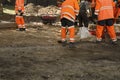 Kyiv/Ukraine - 18 may 2019:Construction site with communal service workers in orange uniform and construction machinery