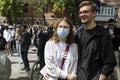 KYIV, UKRAINE - May 21 2021: couple of people in masks on a protest action against police`s abuse of power. The protesters demand