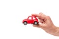 View of man holding red toy car on white Royalty Free Stock Photo