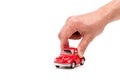 View of man holding red toy car on white Royalty Free Stock Photo