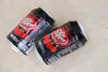 KYIV, UKRAINE - 4 MAY, 2023: Dr Pepper cherry drink black cans