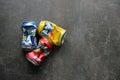 KYIV, UKRAINE - 4 MAY, 2023: Fanta soft drink brand crumpled tin cans with various flavours