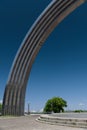 Kyiv, Ukraine - May 10, 2022: half of Arch of Friendship of Peoples in Kyiv against clear blue sky. Copy space