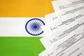 KYIV, UKRAINE - MAY 4, 2022 Indian income tax return blank forms on indian country flag