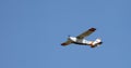 Kyiv, Ukraine - May 12, 2020: A small plane flies in the blue sky. Aircraft Cessna 172RG Cutlass RG, Reg: UR-IFC. Airplane