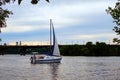 Stylish wealthy female friends having fun on a luxury yacht. Scenic landscape of Kyiv city in the background Royalty Free Stock Photo