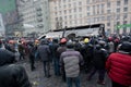 KYIV, UKRAINE: Men crowd turned burned-out bus on