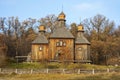 Ancient wooden church and autumn landscape in the Ukrainian national museum open air Pirogovo. Kyiv, Ukraine Royalty Free Stock Photo