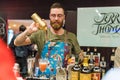 Kyiv, Ukraine - 30 october, 2016: Barman festival. Handsome bearded hipster with long beard and mustache holding shaker