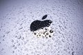 KYIV, UKRAINE - October 03, 2023 : Black Apple logo with water drops. Water resistant modern technology Royalty Free Stock Photo