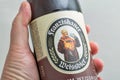 Franziskaner Weissbier bottle closeup against white background. Kyiv, Ukraine