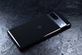 KYIV, UKRAINE - October 03, 2023 : Modern smartphone Google Pixel on black background