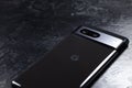 KYIV, UKRAINE - October 03, 2023 : Modern smartphone Google Pixel on black background