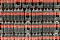 Kyiv, Ukraine, October 2022: - Rows plastic bottles coca-cola soda water in package in stack in grocery department in supermarket