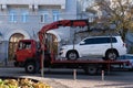 Kyiv, Ukraine, October 16, 2022. Wrecker towing car, vehicle fined for parking violations, evacuation service.