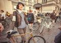 English style women in vintage clothing with old bicycle smiling before the start of festival Retro Cruise