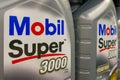 Kyiv, Ukraine, September 24, 2023: - Canisters 5W-40 Mobil super, semi-synthetic engine oil 1 liter on shelf in supermarket