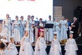 Kyiv, Ukraine - September 1, 2019: Childrens angels in white dresses at Christmas event