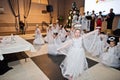 Kyiv, Ukraine - September 1, 2019: Childrens angels in white dresses at Christmas event