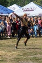 A Georgian man from a group of ethnic dancers from the country of Georgia perform in the open air.