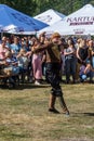 A Georgian man from a group of ethnic dancers from the country of Georgia perform in the open air.