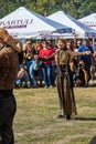 A Georgian woman from a group of ethnic dancers from the country of Georgia perform in the open air.