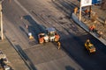 KYIV, UKRAINE - September 10, 2020: Heavy asphalt road roller with heavy vibration roller compactor that press new hot Royalty Free Stock Photo