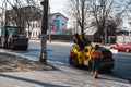 KYIV, UKRAINE - September 10, 2020: Heavy asphalt road roller with heavy vibration roller compactor that press new hot Royalty Free Stock Photo