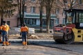 KYIV, UKRAINE - September 10, 2020: Heavy asphalt road roller with heavy vibration roller compactor that press new hot Royalty Free Stock Photo