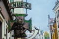 KIEV, Ukraine - September 27,2022:Street iron signboard with the inscription Pharmacy. An iron cat on a sign