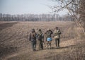 Kyiv, Ukraine - 03/23/2022: Ukrainian soldiers of territorial defense walk along the field Royalty Free Stock Photo