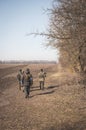 Kyiv, Ukraine - 03/23/2022: Ukrainian soldiers of territorial defense walk along the field Royalty Free Stock Photo