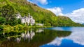 Kylemore Abbey with reflection in lake at the foot of a mountain, Connemara, Ireland Royalty Free Stock Photo