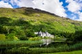 Kylemore Abbey with reflection in lake at the foot of a mountain. Connemara, Ireland Royalty Free Stock Photo