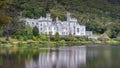 Kylemore Abbey, beautiful white castle with blurred reflection in lake, Connemara Royalty Free Stock Photo