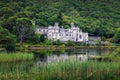 Kylemore Abbey in Ireland with reflections in the Pollacapall Lough Royalty Free Stock Photo