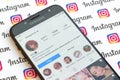 Kylie Jenner official instagram account on smartphone screen on paper instagram banner